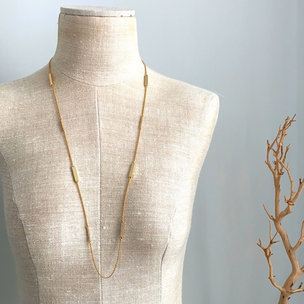 Kate Spade long gold necklace.